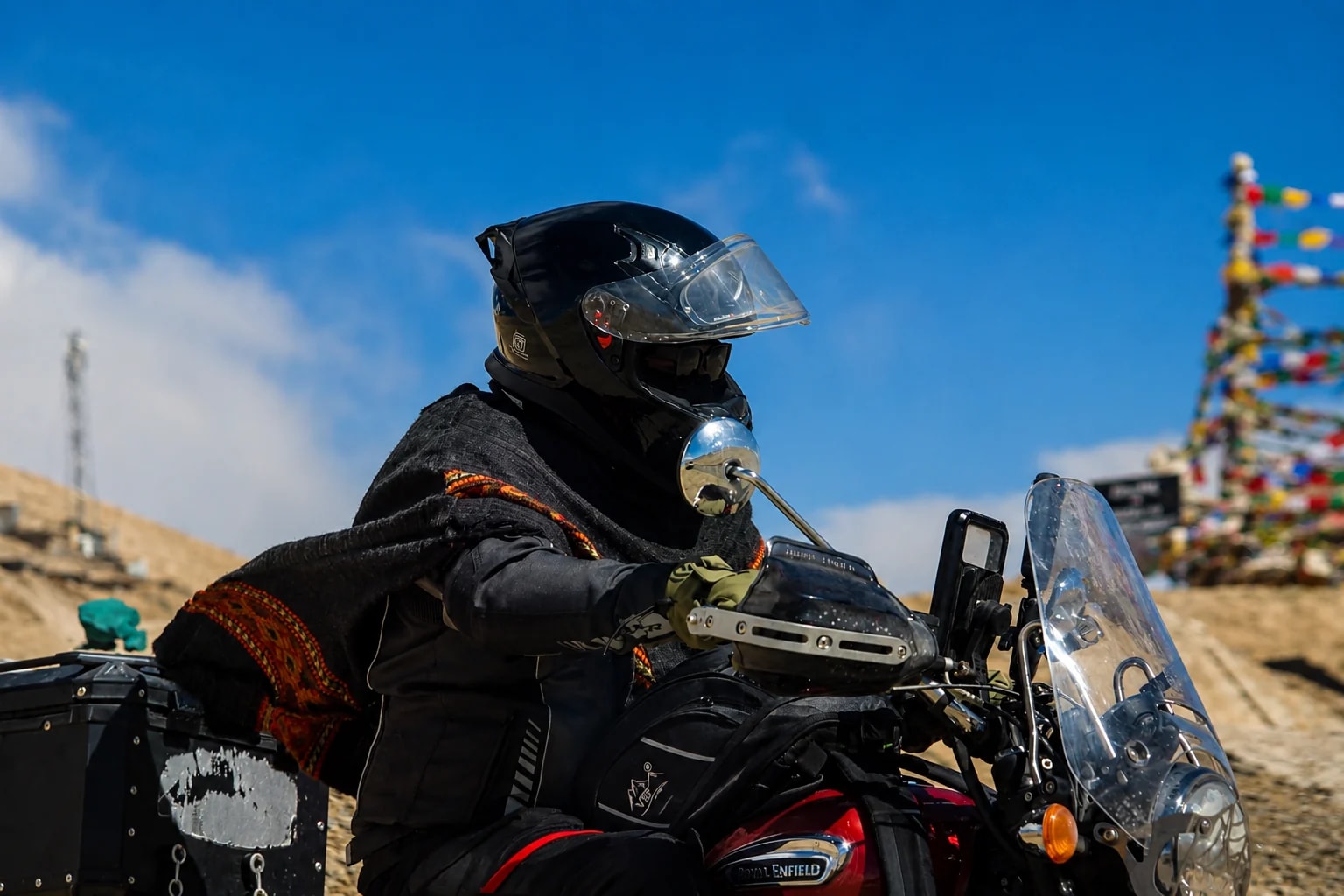 A TIH journey seen from the saddle: a helmeted rider in the Himalayas